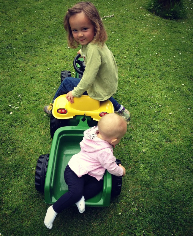 Sisters on a tractor