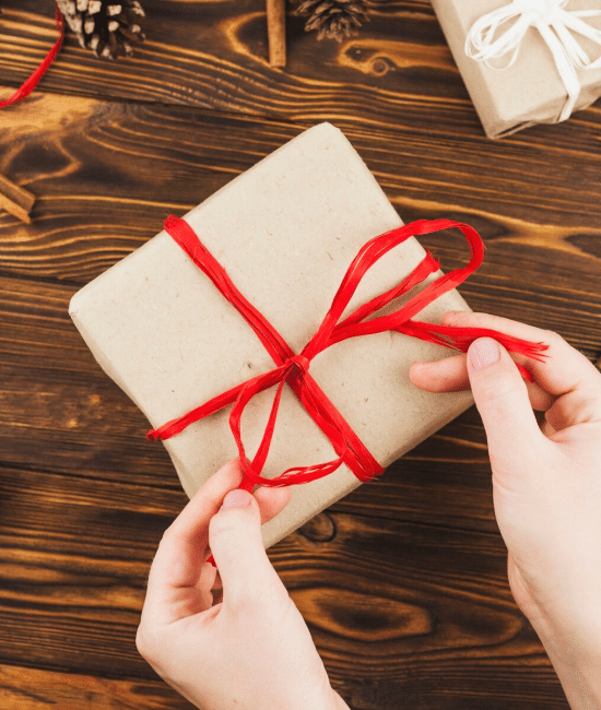hands wrapping gift