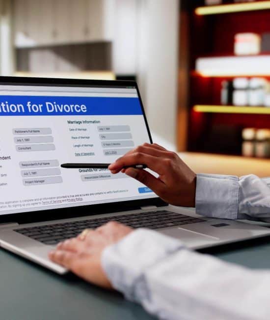 Someone looking at a petition for divorce record on a computer and wondering, “Are divorce records public in Massachusetts?
