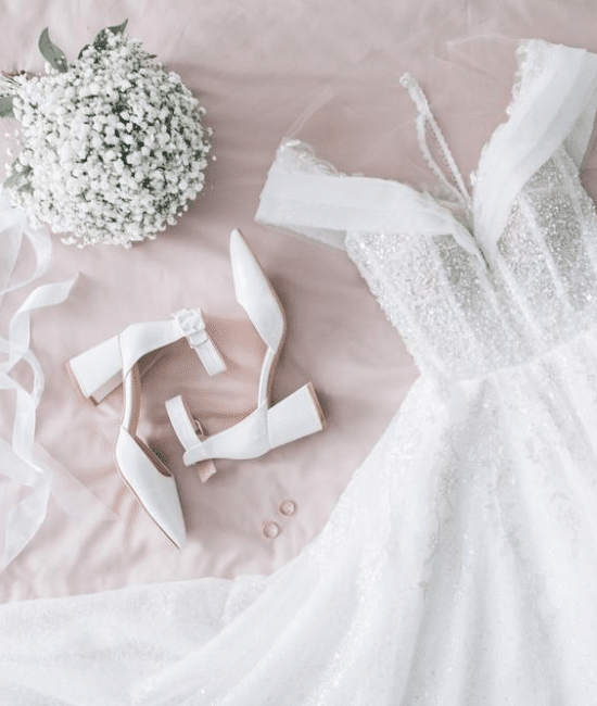 Searching for the perfect dress for your big day? There’s a myriad of styles available, which can make the quest for your dream dress feel overwhelming. While trends come and go, some classic wedding dress styles remain eternally chic, making them a worthwhile consideration. If you’re planning a 2025 wedding, these seven simple white wedding dress styles are your go-to options, each providing a unique charm that transcends fleeting trends. 1. Princess Wedding Dress The princess wedding dress is a fairy-tale favourite that continues to capture hearts across Australia. Known for its fitted bodice and voluminous skirt, this silhouette creates a dramatic yet elegant look. It works beautifully for formal church ceremonies as well as outdoor venues. Australian brides often pair princess dresses with delicate lace overlays or subtle beadwork to keep the look sophisticated without appearing overdone. For warmer regions such as Queensland, consider a lightweight tulle skirt that flows effortlessly in the breeze while keeping you comfortable during outdoor celebrations. 2. A-Line Wedding Dress A-line wedding dresses are a universal favourite, celebrated for their flattering fit on virtually every body type. The silhouette gently flares from the waist to the hem, resembling the shape of the letter “A,” which provides elegance without excess volume. Perfect for both beach weddings in Byron Bay and vineyard ceremonies in the Barossa Valley, A-line dresses strike a balance between comfort and sophistication. Australian designers often incorporate lightweight fabrics like chiffon or organza, making the dress breezy and ideal for the country’s warmer climates. Minimalistic detailing such as subtle pleats or a simple belt can elevate the gown while maintaining a timeless appeal. 3. Off-the-Shoulder Wedding Dress For brides seeking a romantic, contemporary style, the off-the-shoulder wedding dress offers the perfect mix of allure and refinement. This neckline accentuates the shoulders and collarbone, creating a flattering silhouette while remaining understatedly elegant. Off-the-shoulder dresses are particularly suited for intimate weddings in coastal venues like the Sunshine Coast or scenic garden ceremonies. Lightweight lace or soft satin enhances the romantic feel, while three-quarter or full-length sleeves can provide additional coverage for cooler evenings without compromising the airy design. 4. Long Sleeve Wedding Dress Long sleeve wedding dresses have seen a resurgence in popularity, blending modesty with glamour. This style is particularly suitable for formal ceremonies and provides a regal, sophisticated appearance. For Australian weddings in winter or during cooler evenings in southern states like Tasmania or Victoria, long sleeves offer comfort without sacrificing style. Designers often opt for sheer fabrics or lace detailing to keep the look light and elegant. For example, an illusion lace sleeve can provide coverage while maintaining a delicate, feminine aesthetic. Long sleeves can also complement outdoor weddings where sun protection is desirable without the need for heavy layers. 5. High Neck Wedding Dress High neck wedding dresses are perfect for brides who favour understated elegance. The neckline creates a refined, polished look, drawing attention to the face while elongating the silhouette. This style is ideal for formal venues like churches. Modern high-neck dresses often feature lace inserts, subtle embroidery, or even open-back designs, combining sophistication with a hint of modernity. For brides seeking simplicity without sacrificing style, this silhouette is a go-to choice for 2025 weddings. 6. Strapless Wedding Dress The strapless wedding dress is a classic choice that exudes confidence and modern charm. With no straps or sleeves, this style highlights the shoulders and arms, allowing for freedom of movement, perfect for outdoor and beach ceremonies. Popular among brides in warmer climates, strapless gowns pair beautifully with statement jewellery or a delicate veil. Australian designers often incorporate structured bodices for added support, ensuring the gown remains comfortable throughout the day. From minimalist silk designs to intricate lace overlays, strapless dresses provide versatility that suits a wide range of wedding themes. 7. Ballgown Wedding Dress Though similar to the princess style, the classic ballgown deserves its own spotlight. Characterised by a fitted bodice and a full, floor-length skirt, ballgowns are synonymous with timeless bridal glamour. They are perfect for brides who want to make a statement, whether walking down the aisle of a historic church or an elegant city ballroom. Lightweight materials and modern construction techniques ensure that even full-skirted gowns remain comfortable, while subtle embellishments such as embroidered details or soft lace keep the look sophisticated. The ballgown continues to be a favourite for brides who want a dramatic yet refined silhouette. Conclusion Classic wedding dress styles never go out of fashion. From strapless to high neck, from A-line to ballgown, these silhouettes offer a perfect blend of elegance, simplicity, and versatility for brides across Australia. In 2025, the trend is moving towards dresses that balance comfort with sophistication, making it easier than ever to feel confident and radiant on your special day.