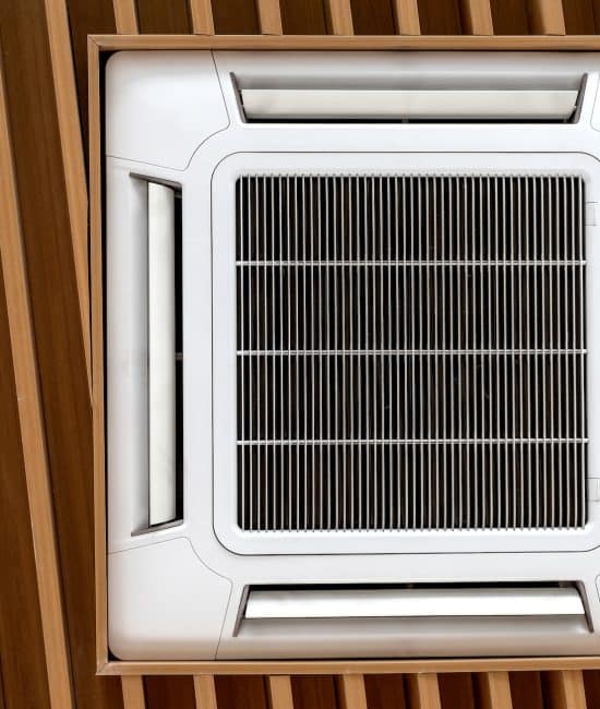 Air conditioner cassette type installed on wooden ceilings.