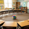 Classroom setup for silent ball, an indoor recess game using a soft foam ball and desks arranged in a circle