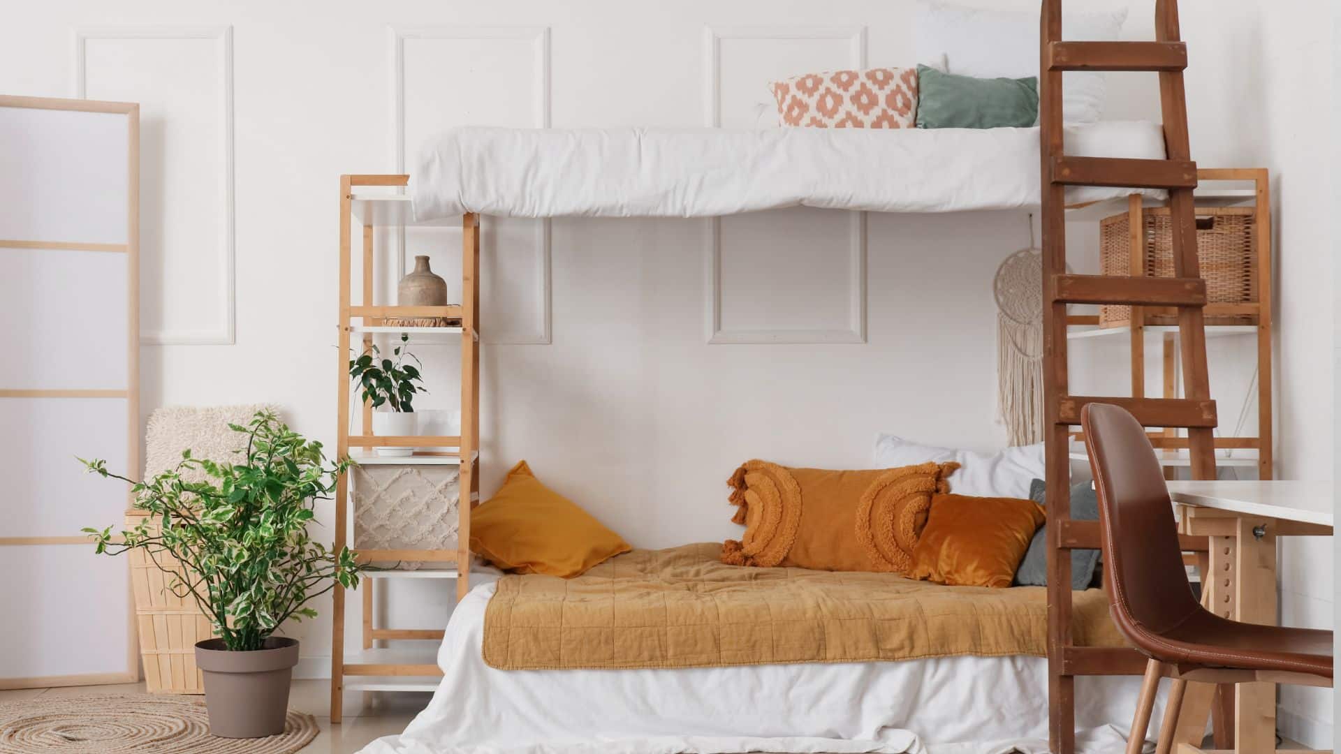 DIY bunk beds with wooden ladder, lofted top bed, and cozy lower bed setup with desk and shelves in a bright minimalist bedroom