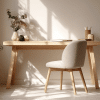 Minimalist home office featuring a light wood desk, textured neutral chair, and abundant natural light casting shadows.