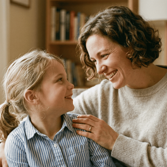 Parent encouraging child with supportive smile at home.