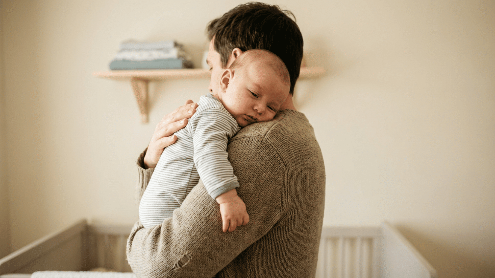 Parent gently burping baby to help relieve hiccups in a calm setting