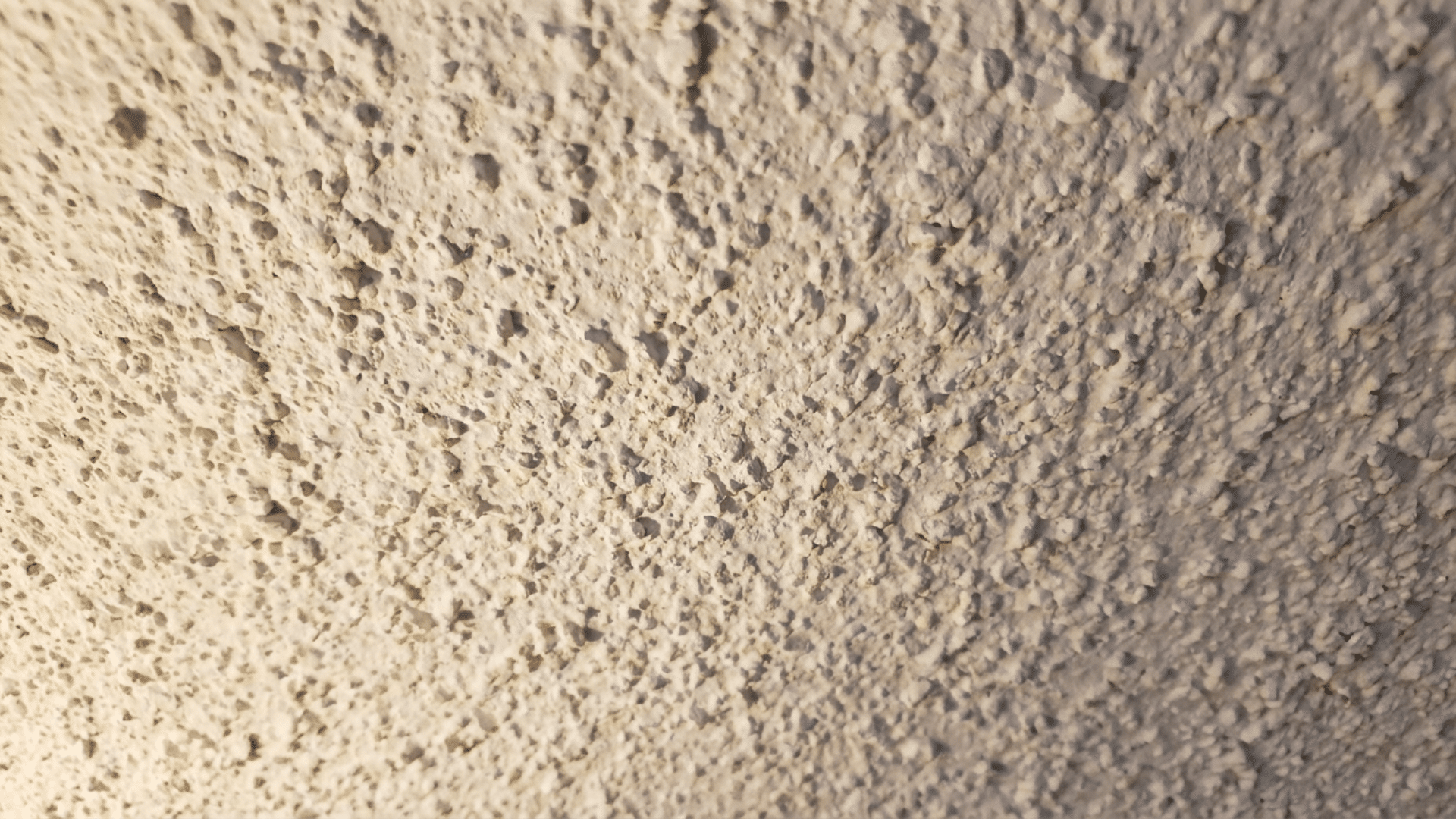 Popcorn ceiling texture with thick bumpy drywall finish