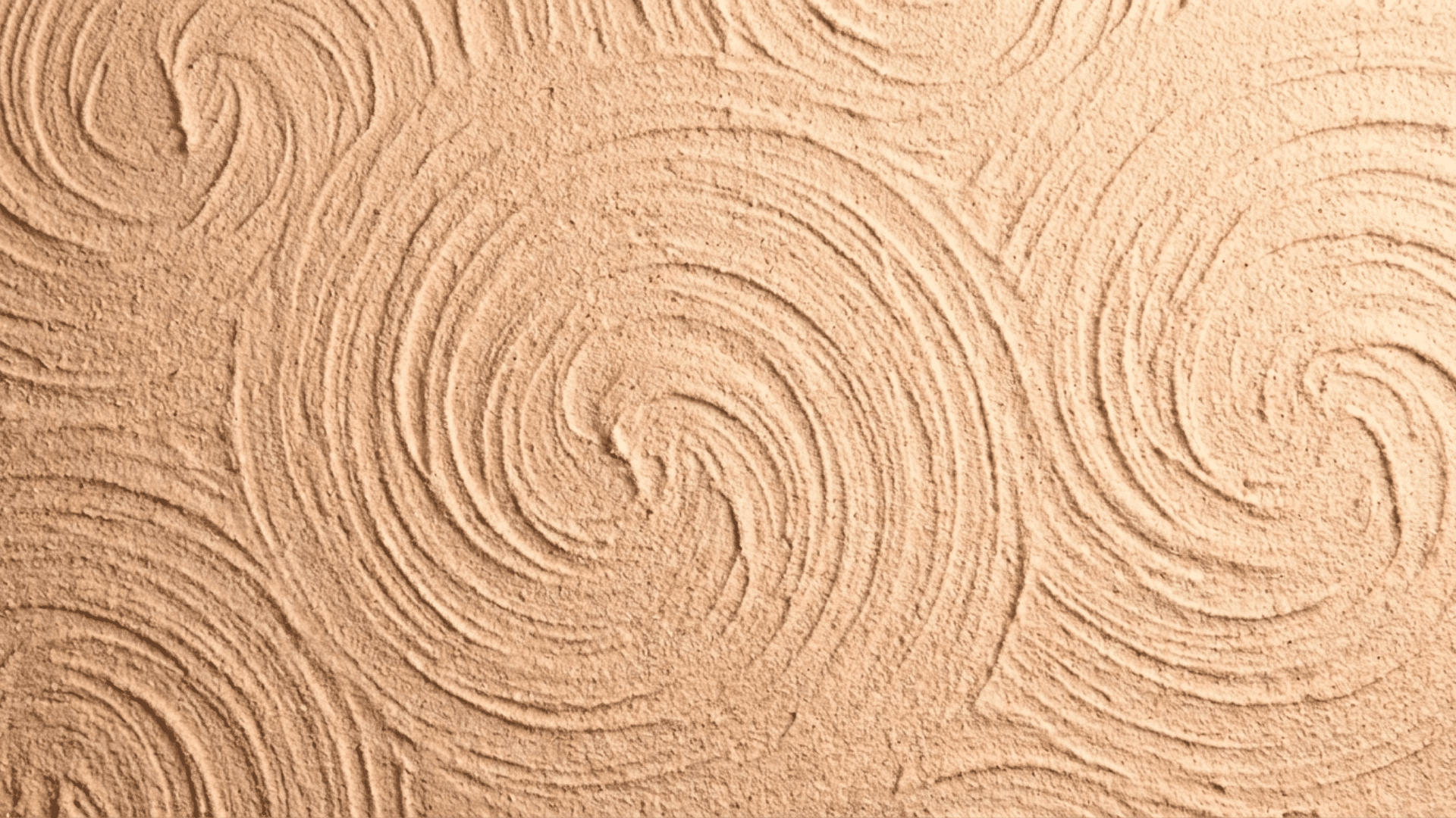 Sand swirl drywall texture with circular decorative patterns