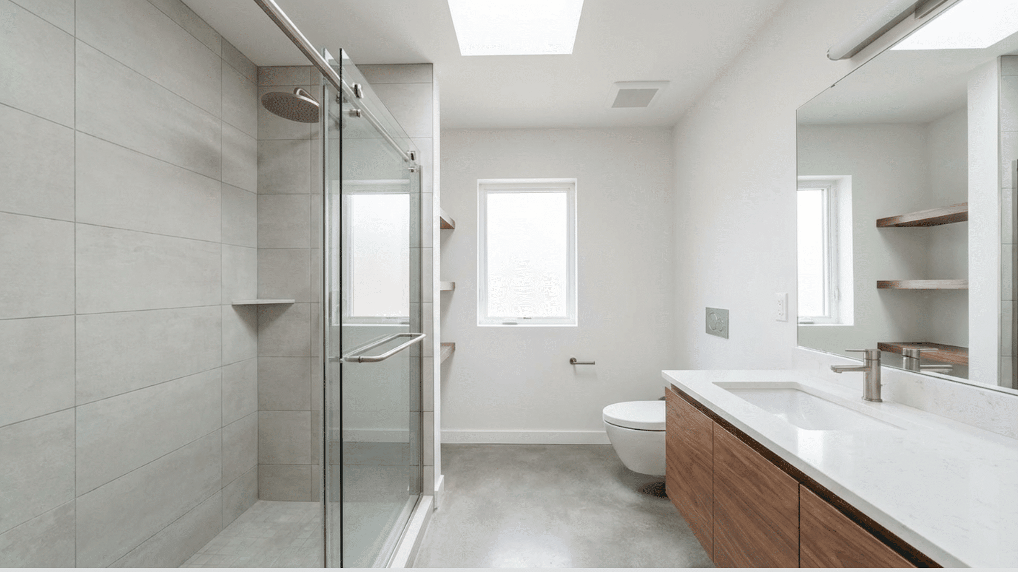 Sliding glass shower door saving space in a narrow bathroom