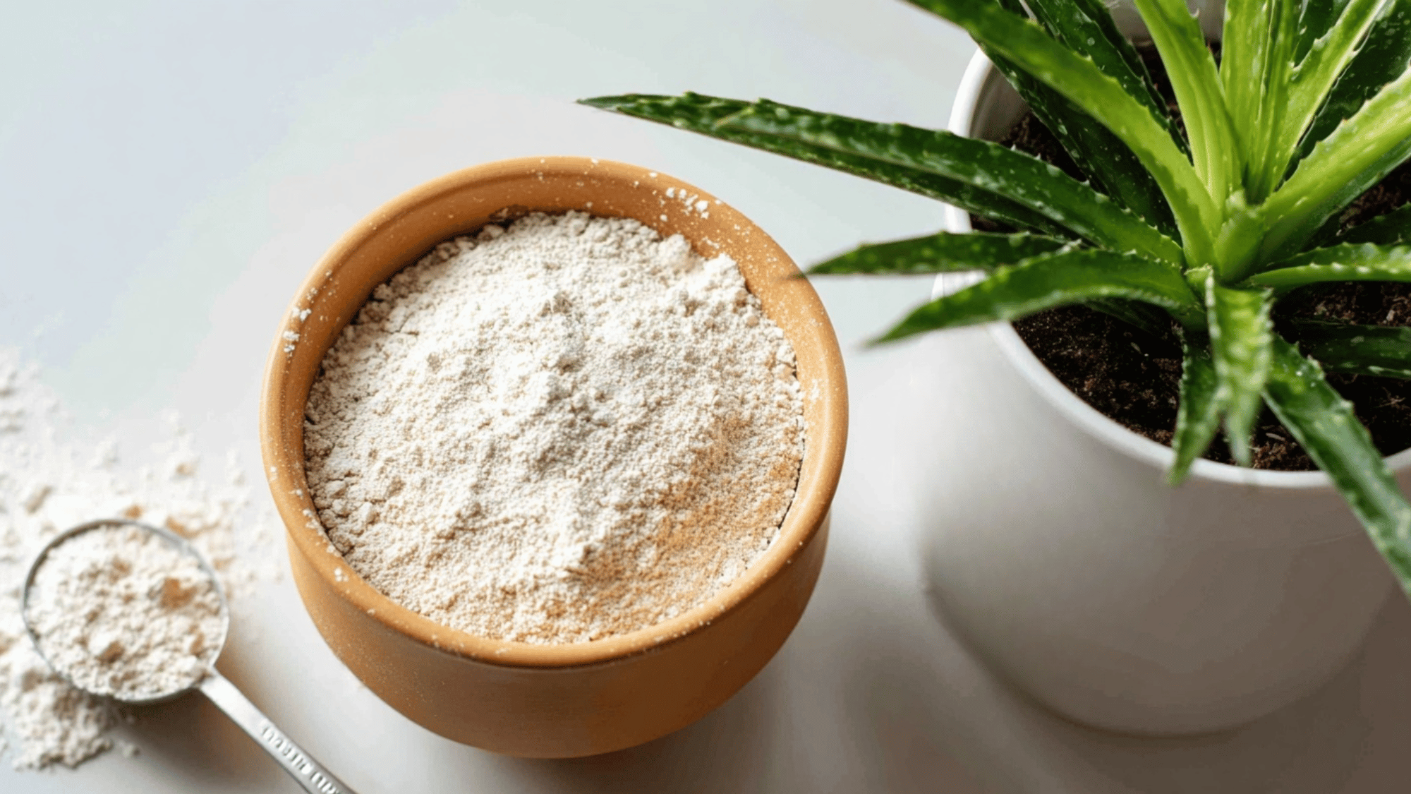 Sprinkling diatomaceous earth on houseplant soil to control thrips larvae.