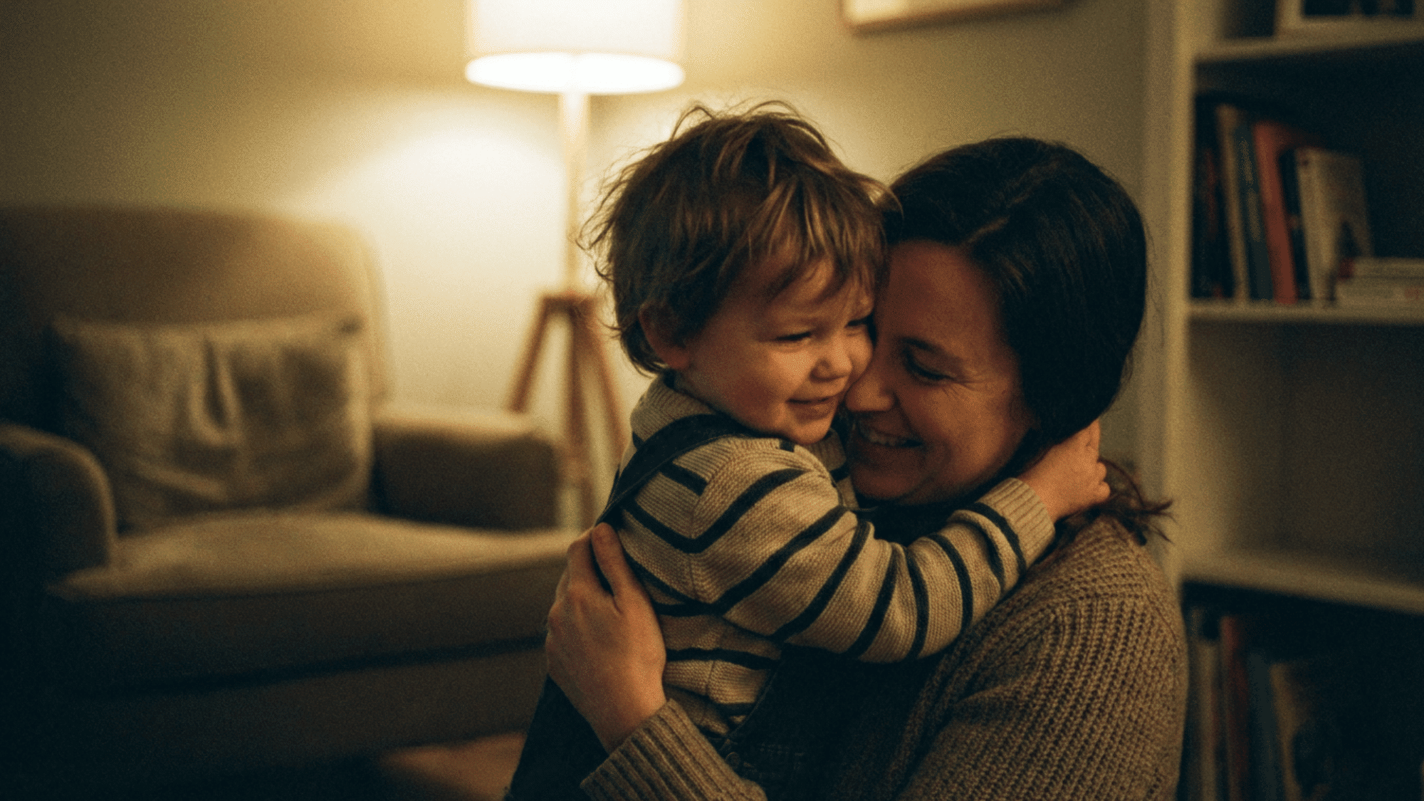 Toddler hugging parent showing emotional bonding and social development