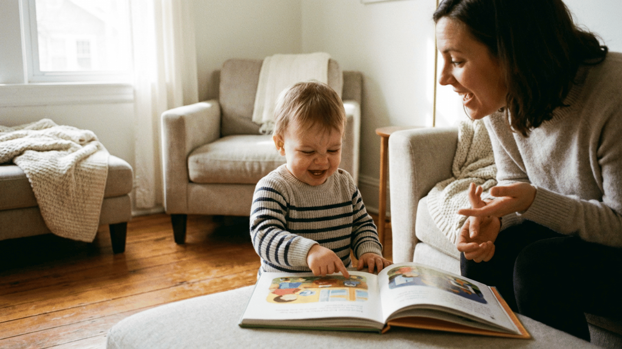 Toddler pointing at book and communicating with parent using gestures
