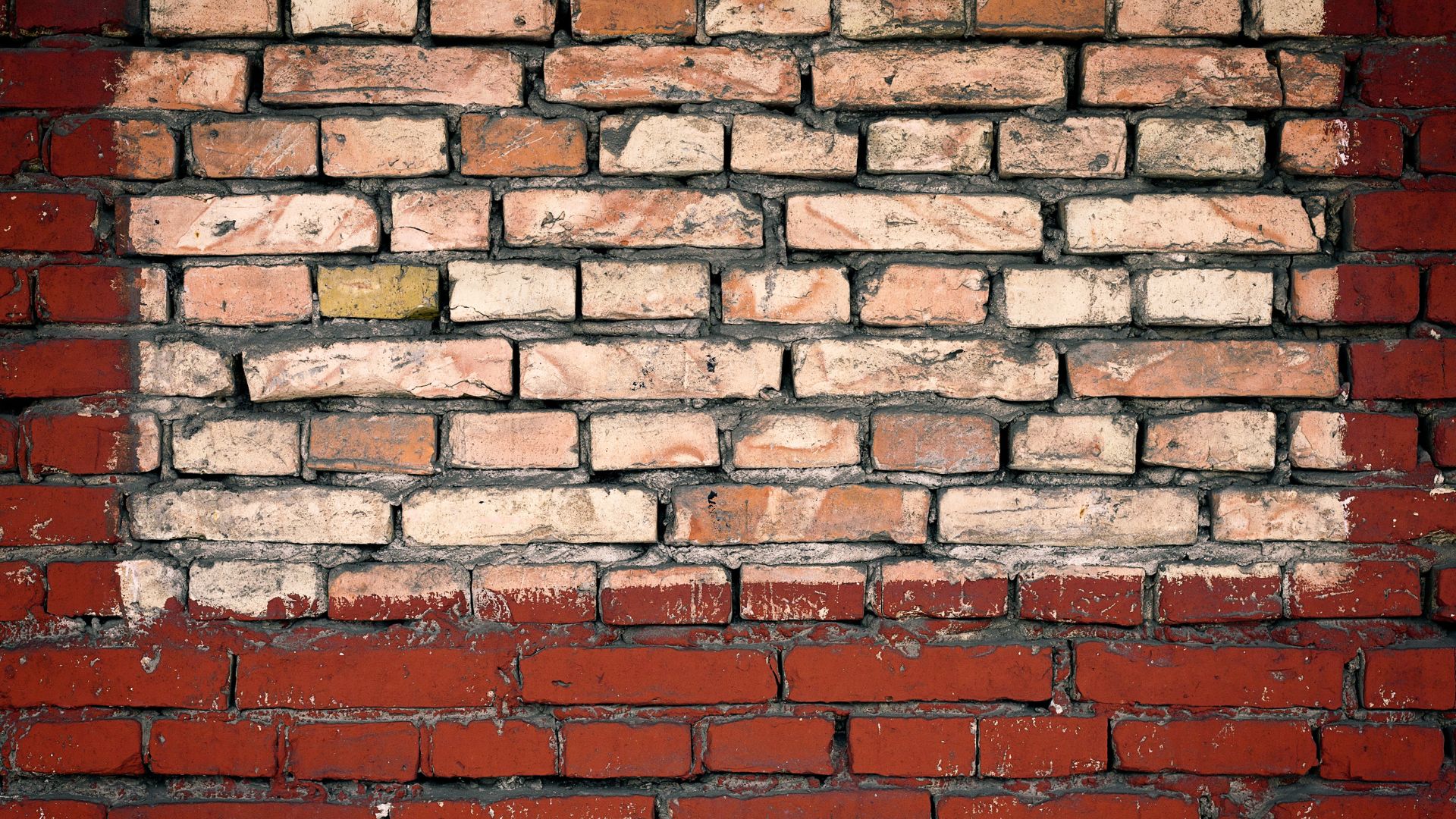 Weathered brick wall with uneven texture and faded colors, ideal surface prep example for how to paint brick before applying primer and paint