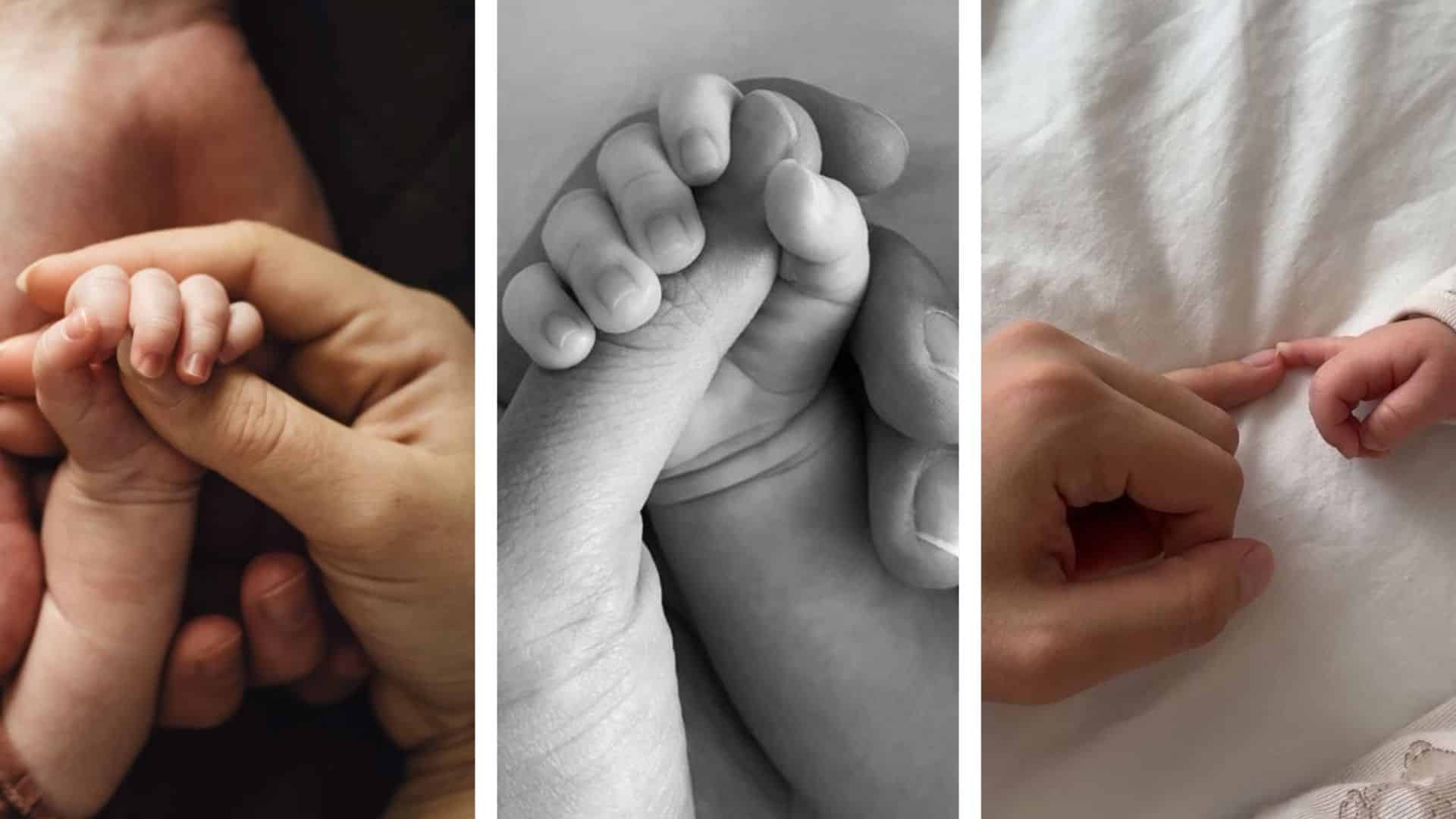 close up of tiny hands holding a parent finger