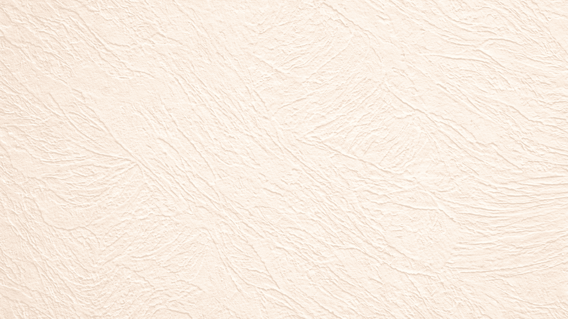 Close-up of beige skip trowel drywall texture with irregular hand-applied patterns, matte finish, and soft lighting highlighting depth
