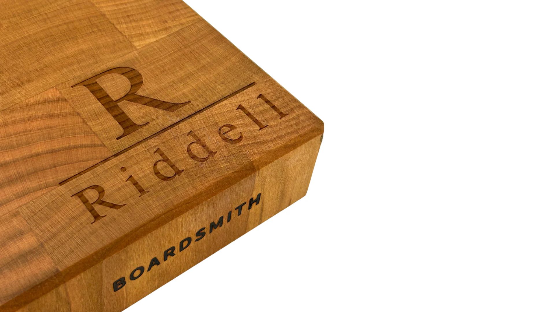 Engraved wooden cutting board personalized with family name, a meaningful Mother's Day kitchen gift for grandma