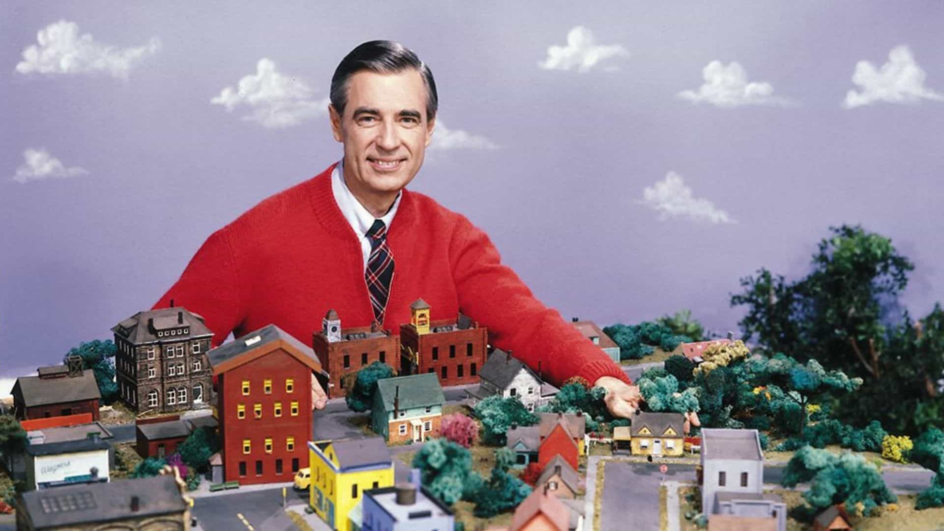Mr. Rogers with a miniature neighborhood set from Mister Rogers’ Neighborhood, one of the best educational shows for kids teaching kindness and social skills