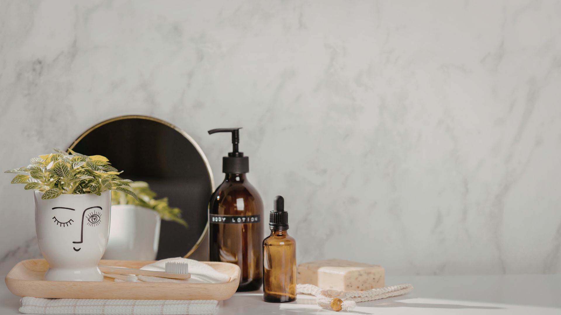 bathroom countertop styled with decorative tray holding essentials and decor creating an organized aesthetic look