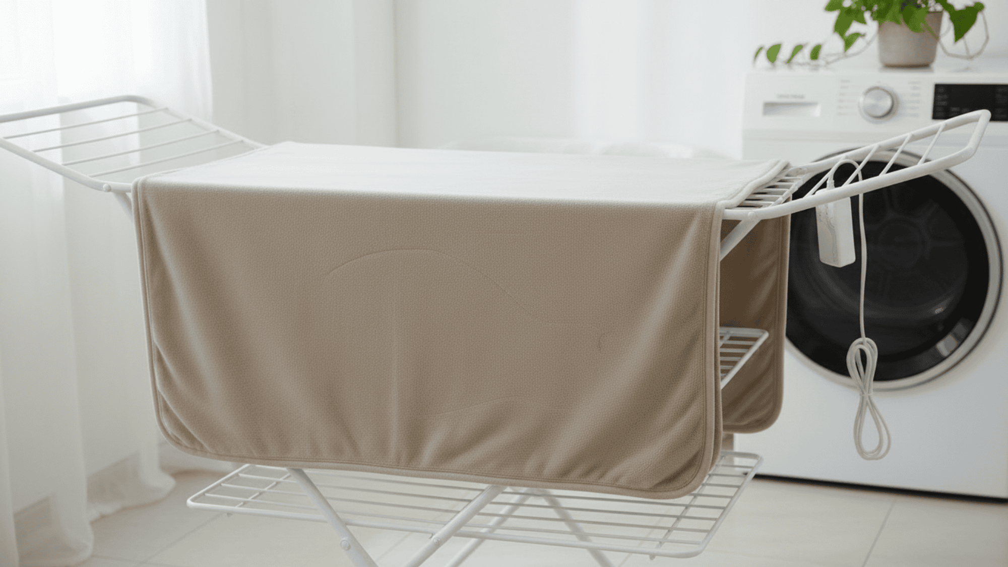 Drying heated blanket safely on flat surface or low heat dryer