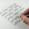 Hand drawing 3D cubes in perspective grid with pencil on paper