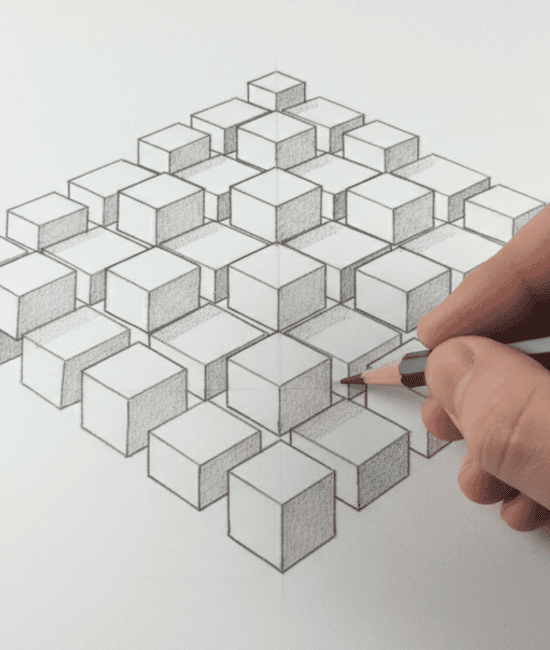 Hand drawing 3D cubes in perspective grid with pencil on paper