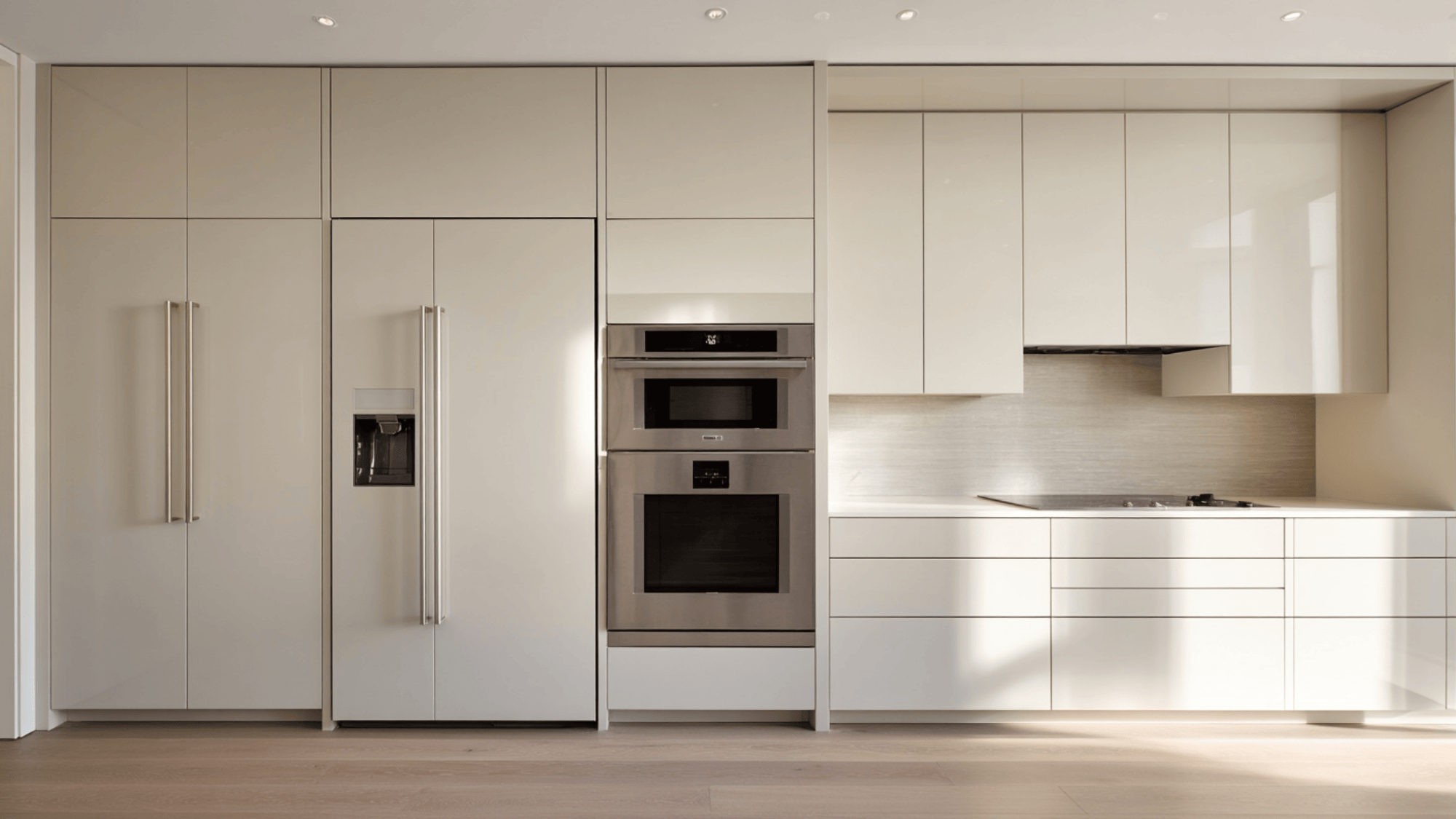 Kitchen with built-in appliances hidden in full-height cabinets