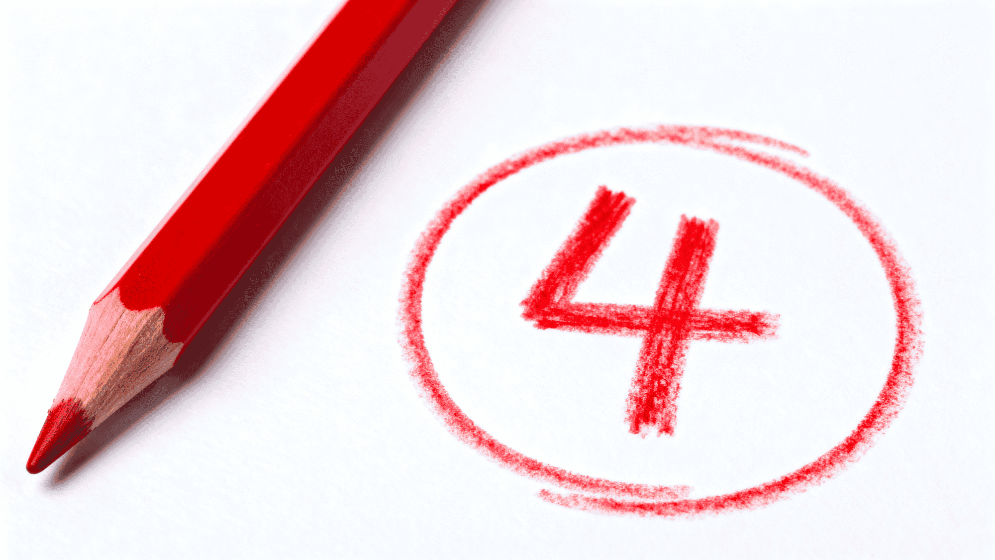 Red pencil beside circled number 4 on white paper representing a grading mark or top score