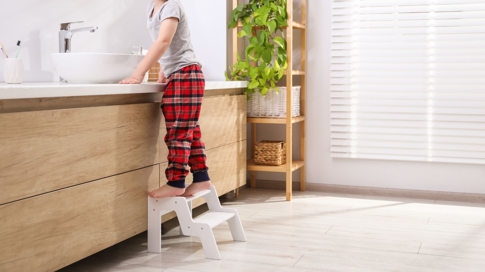 small wooden stool placed in bathroom adding both function and decorative natural texture to the space