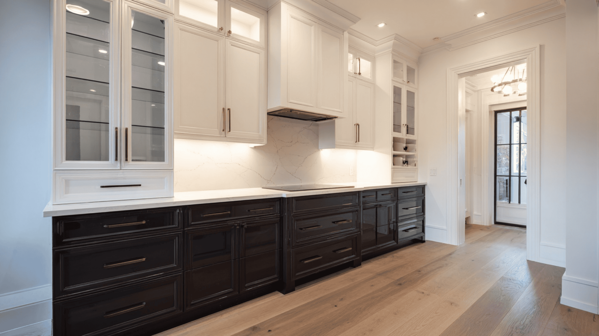 Two-tone kitchen cabinets with dark base and light upper sections