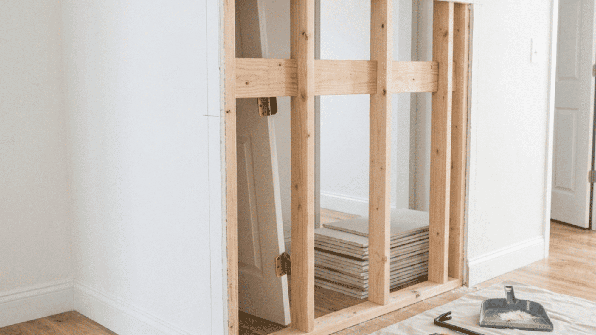 Cutting open the wall and exposing studs for a pocket door frame (1)