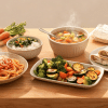 Family dinner table with affordable homemade meals, vegetables, pasta, and rice dishes in a cozy kitchen. (1)