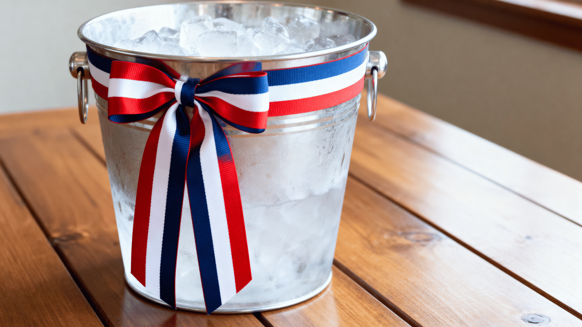 Ice bucket with patriotic decoration on table