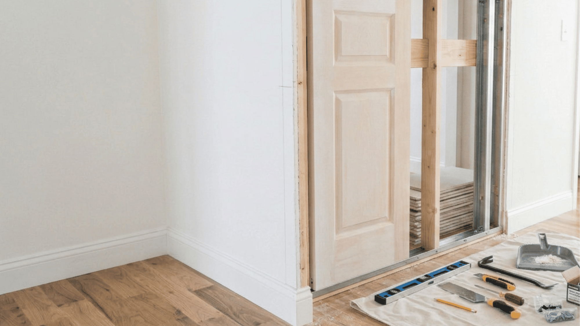 Installing and leveling the pocket door frame inside the wall