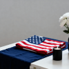 Memorial Day decor with red white blue and black elements on a simple table