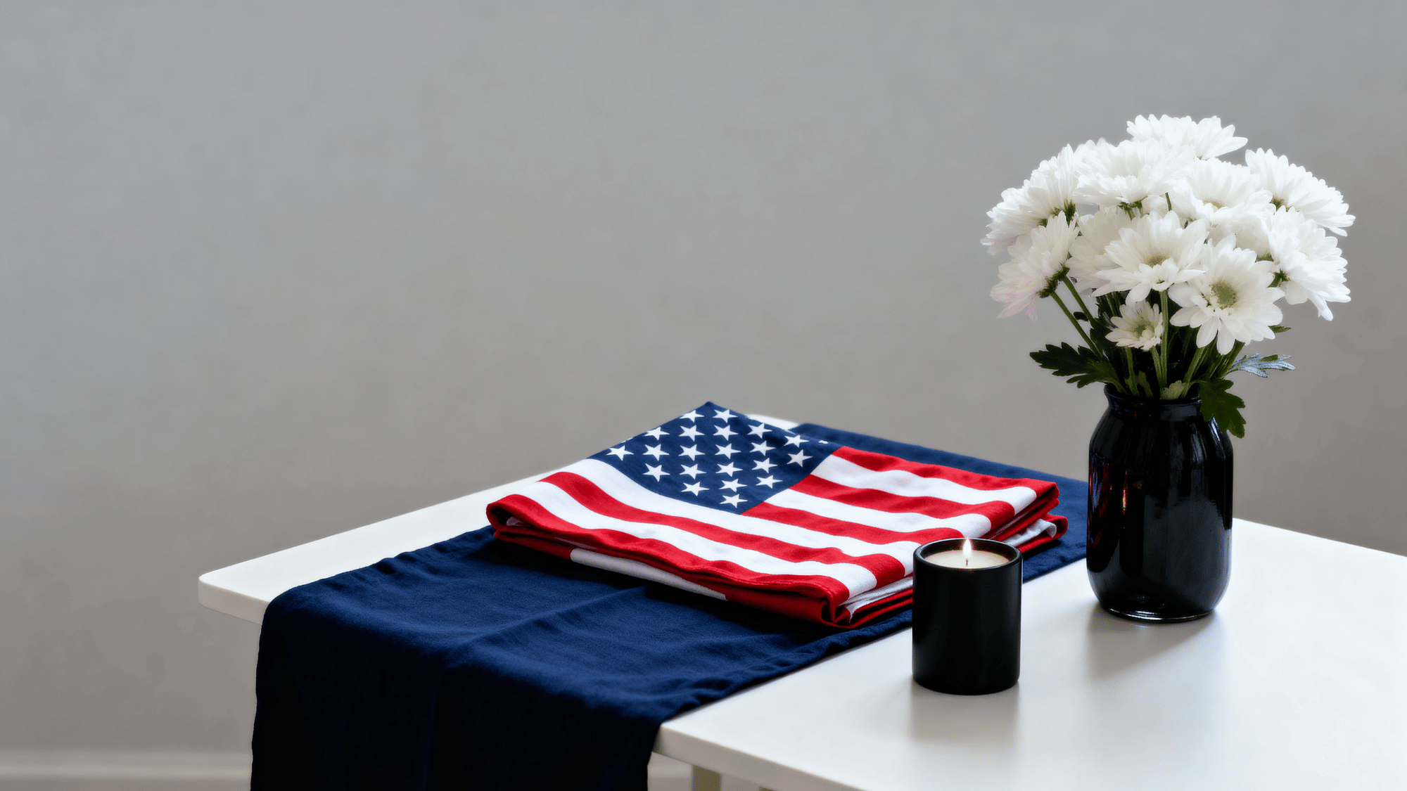 Memorial Day decor with red white blue and black elements on a simple table