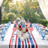 Memorial Day table setup with red white and blue decor in a clean and balanced hero image style