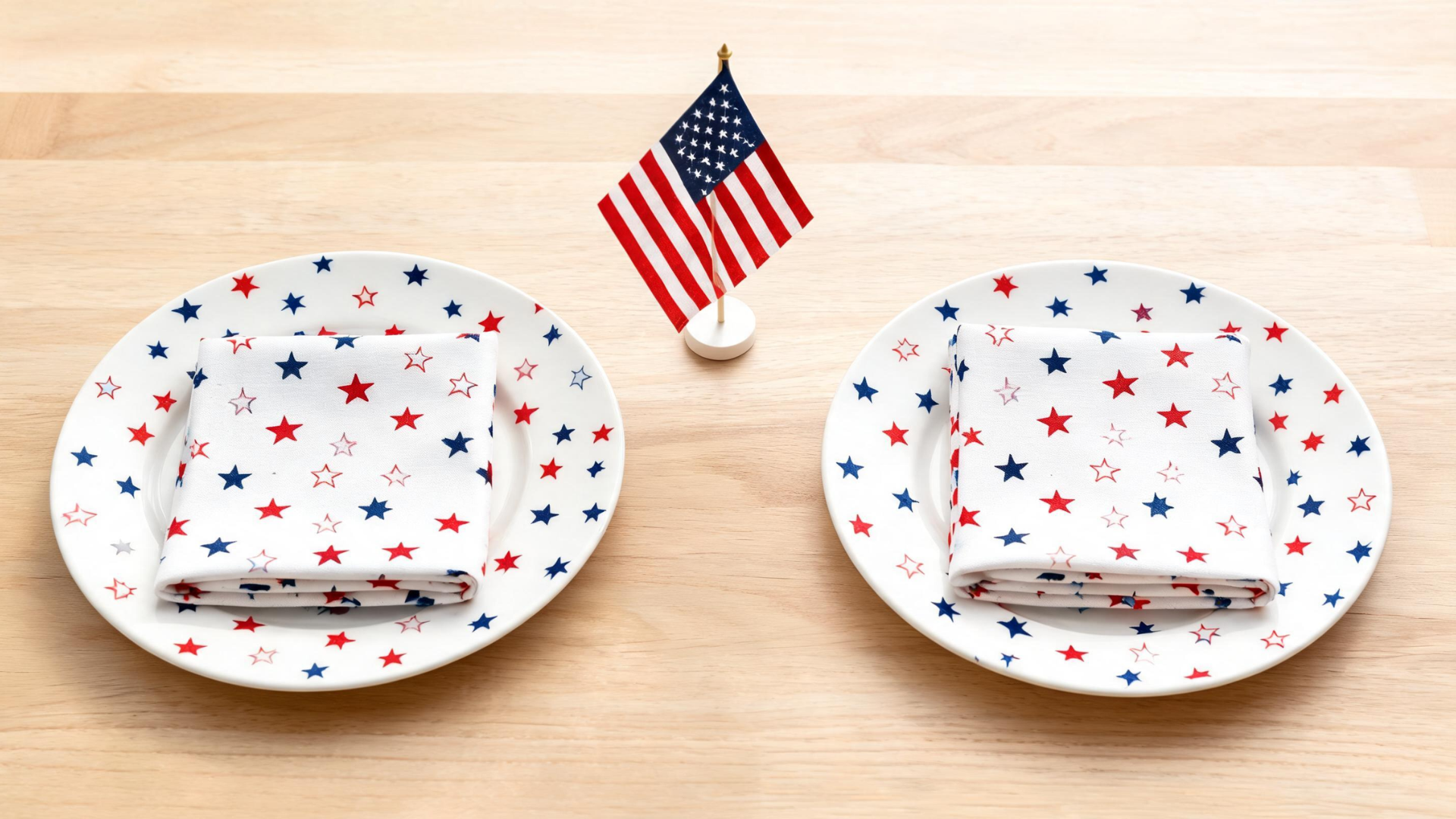 Memorial Day table with star themed napkins and decor arranged in a clean layout