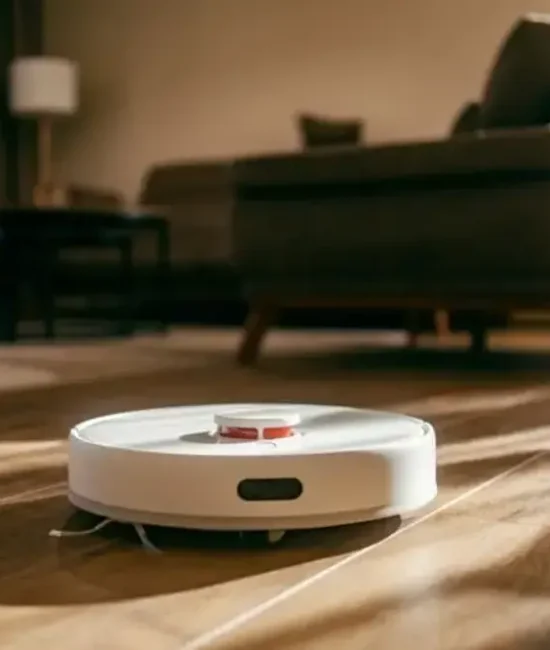Robotic vacuum cleaner on wooden floor in sunlit living room with modern furniture