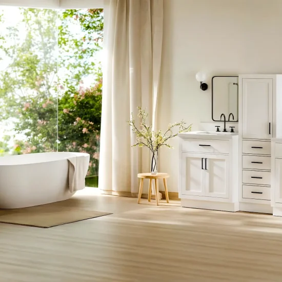 Modern bathroom with freestanding bathtub and white double vanity near large windows