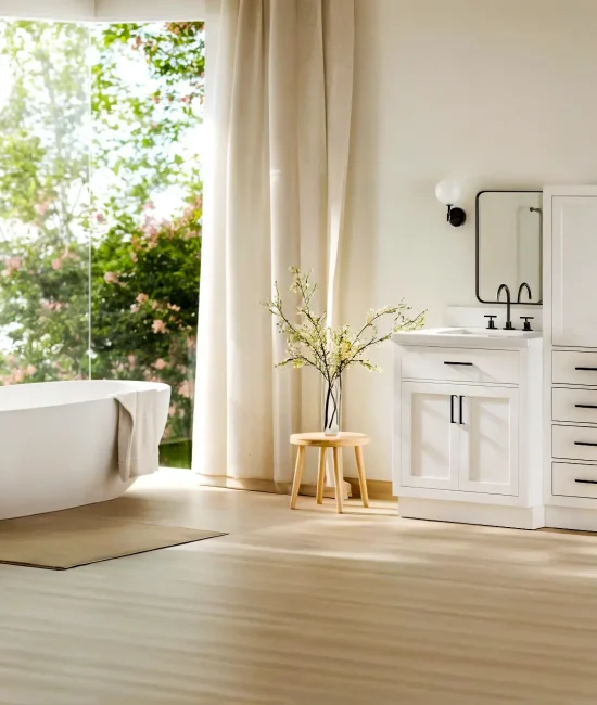 Modern bathroom with freestanding bathtub and white double vanity near large windows
