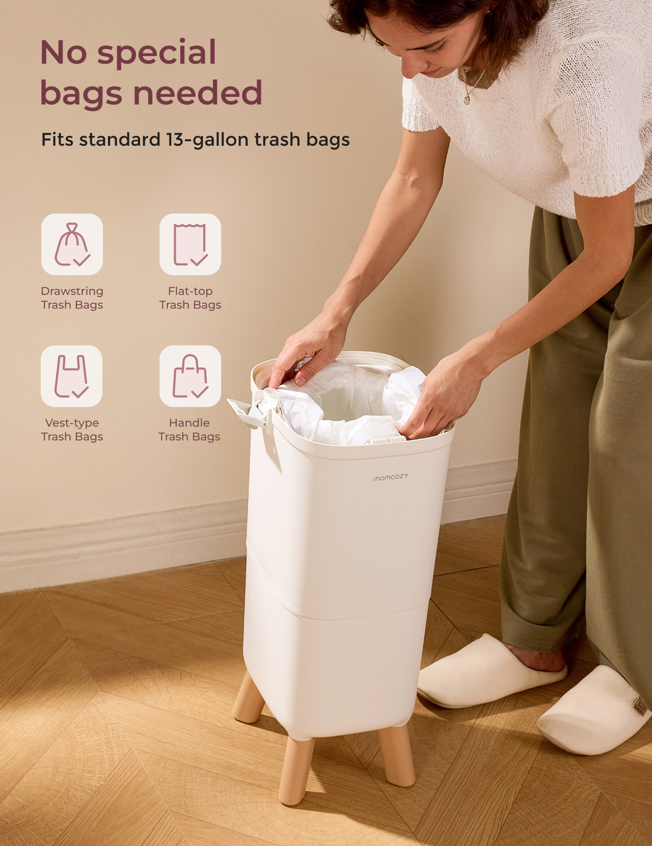 Woman placing trash bag in white bin with wooden legs on parquet floor